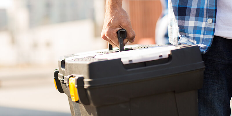 Man holding toolbox