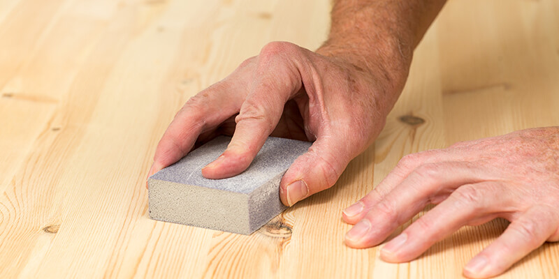 Sanding down wood