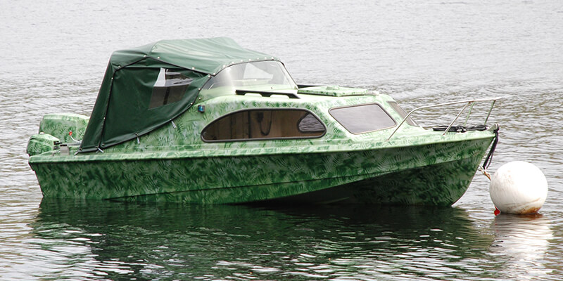 Camo boat on water