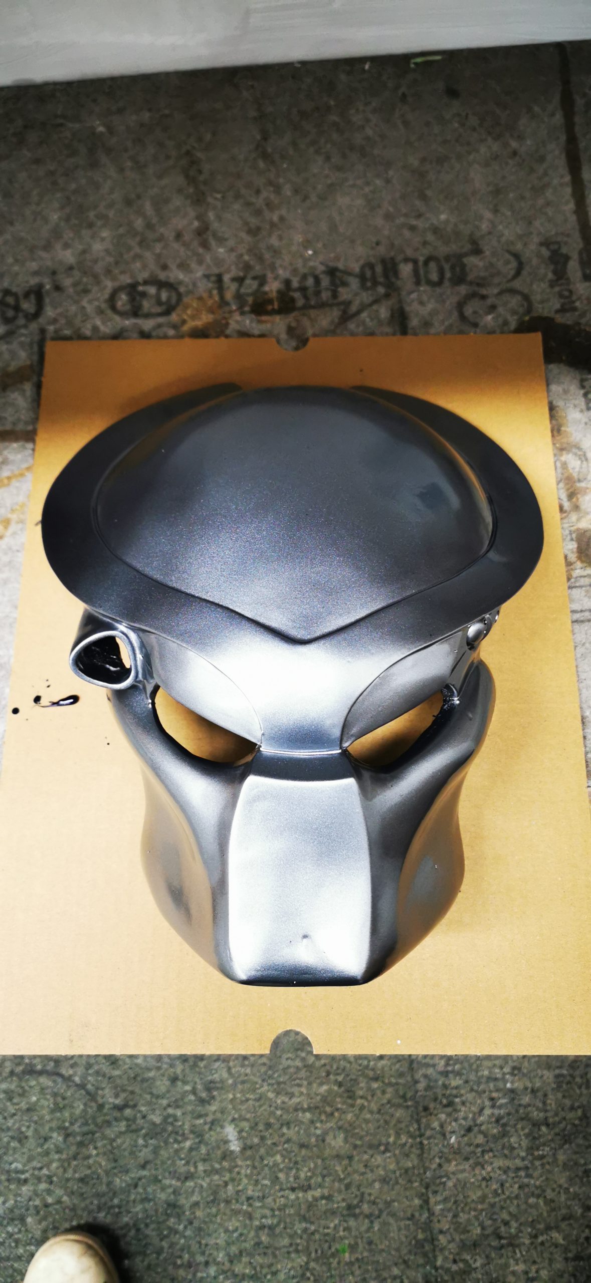mask sprayed with metallic paint