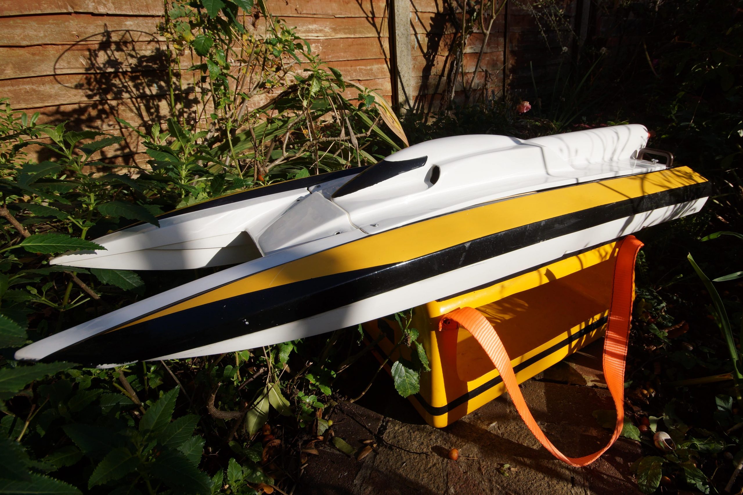 model boat with yellow stripe