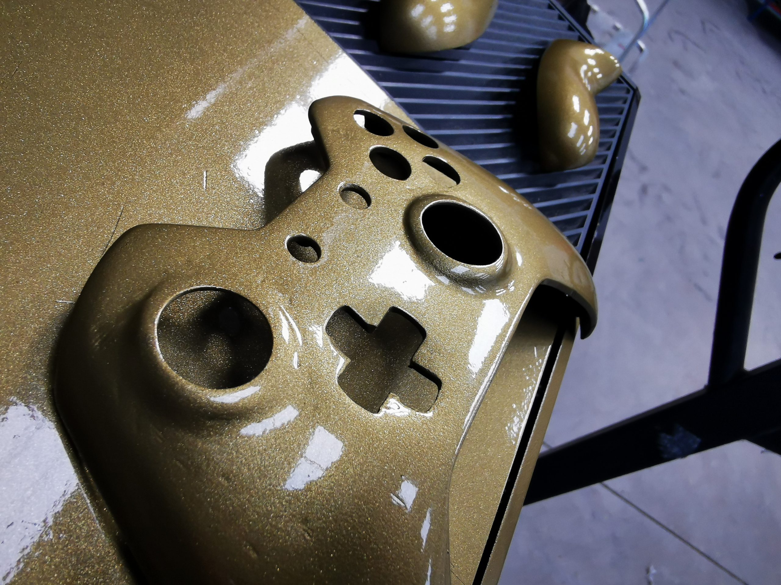 up close of gold controller