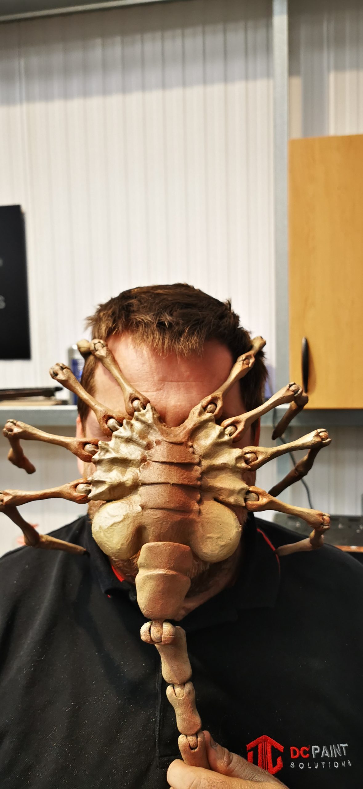 alien face hugger on team member