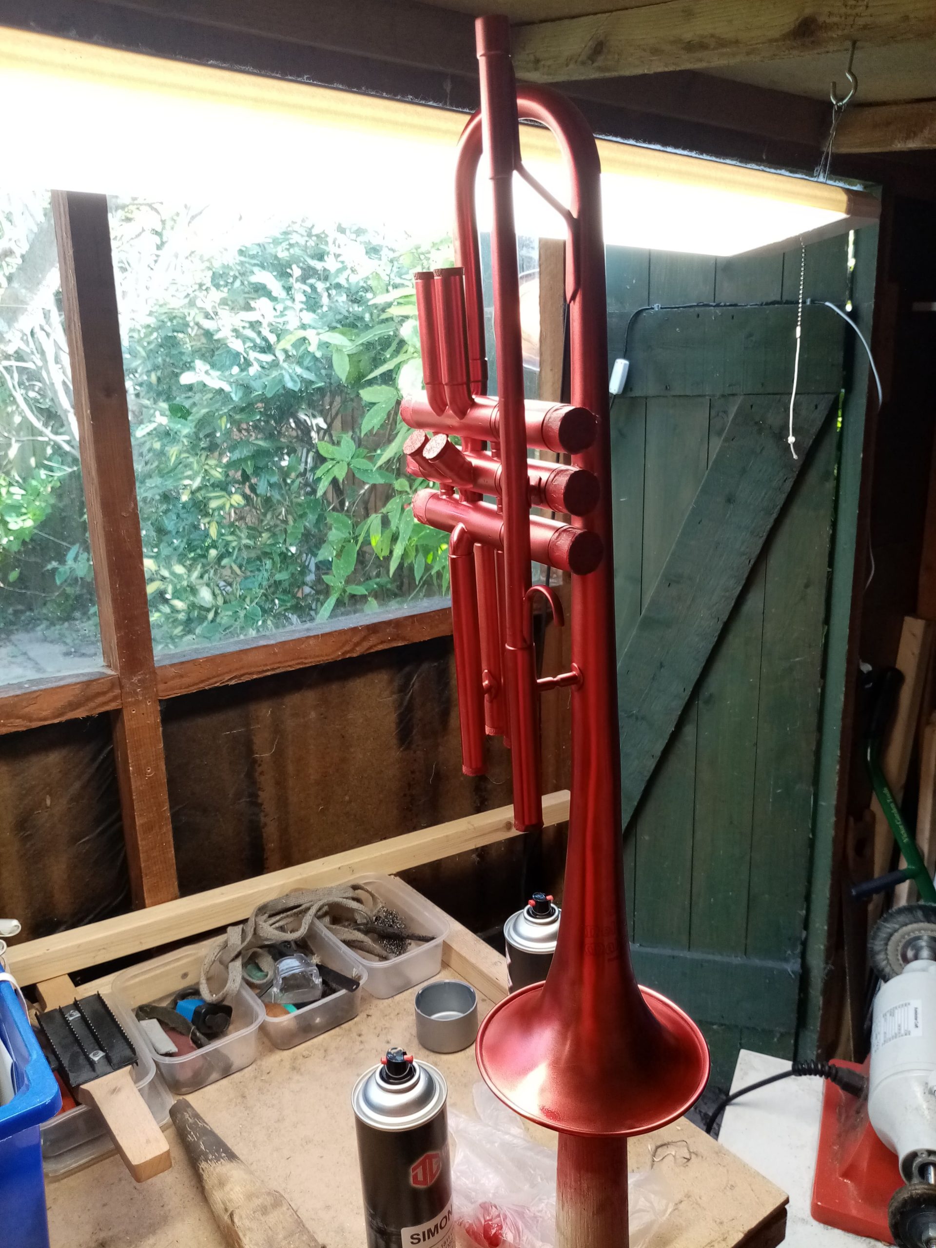 red lacquer trumpet during repaint
