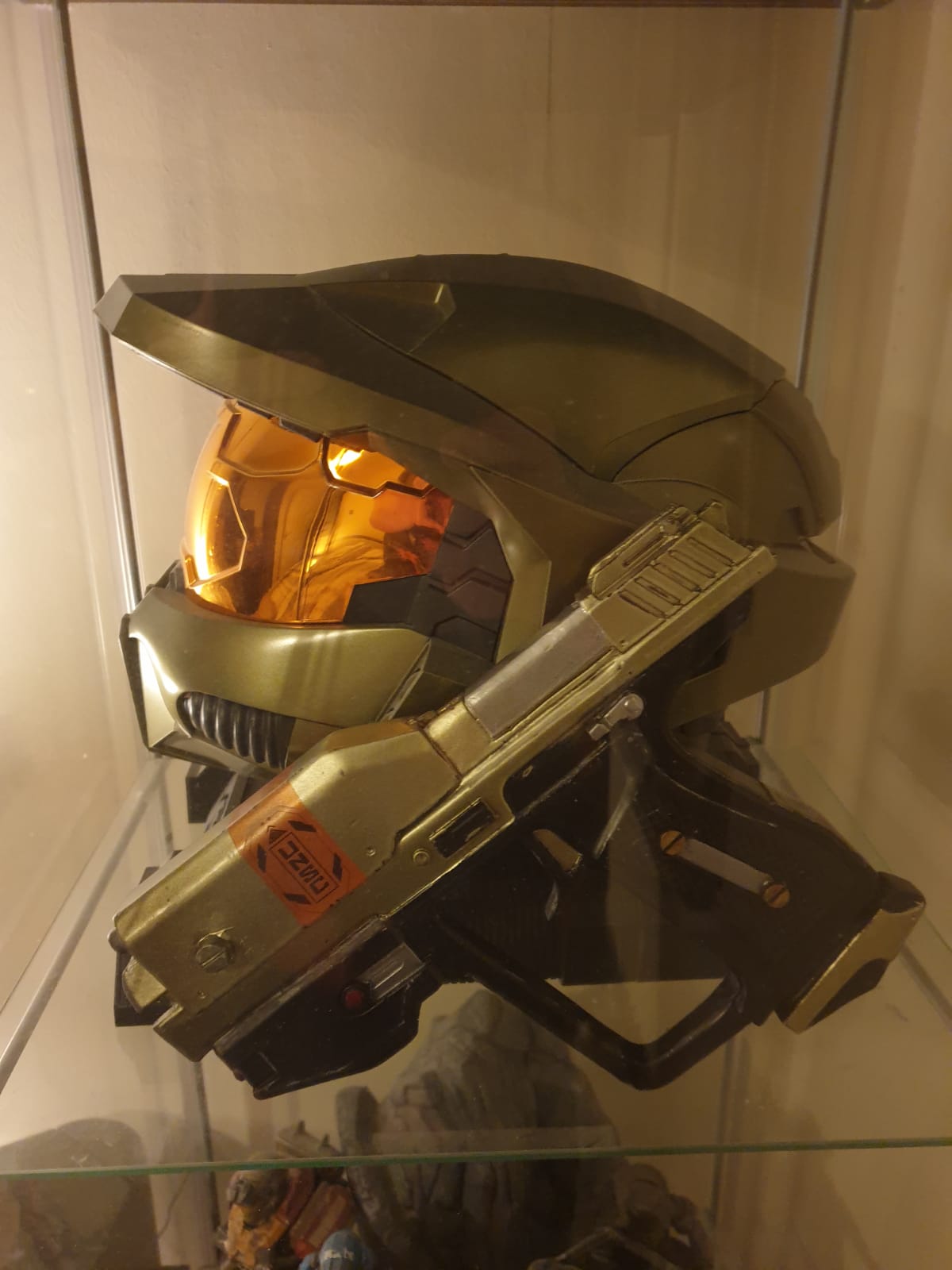 halo helmet and gun on display