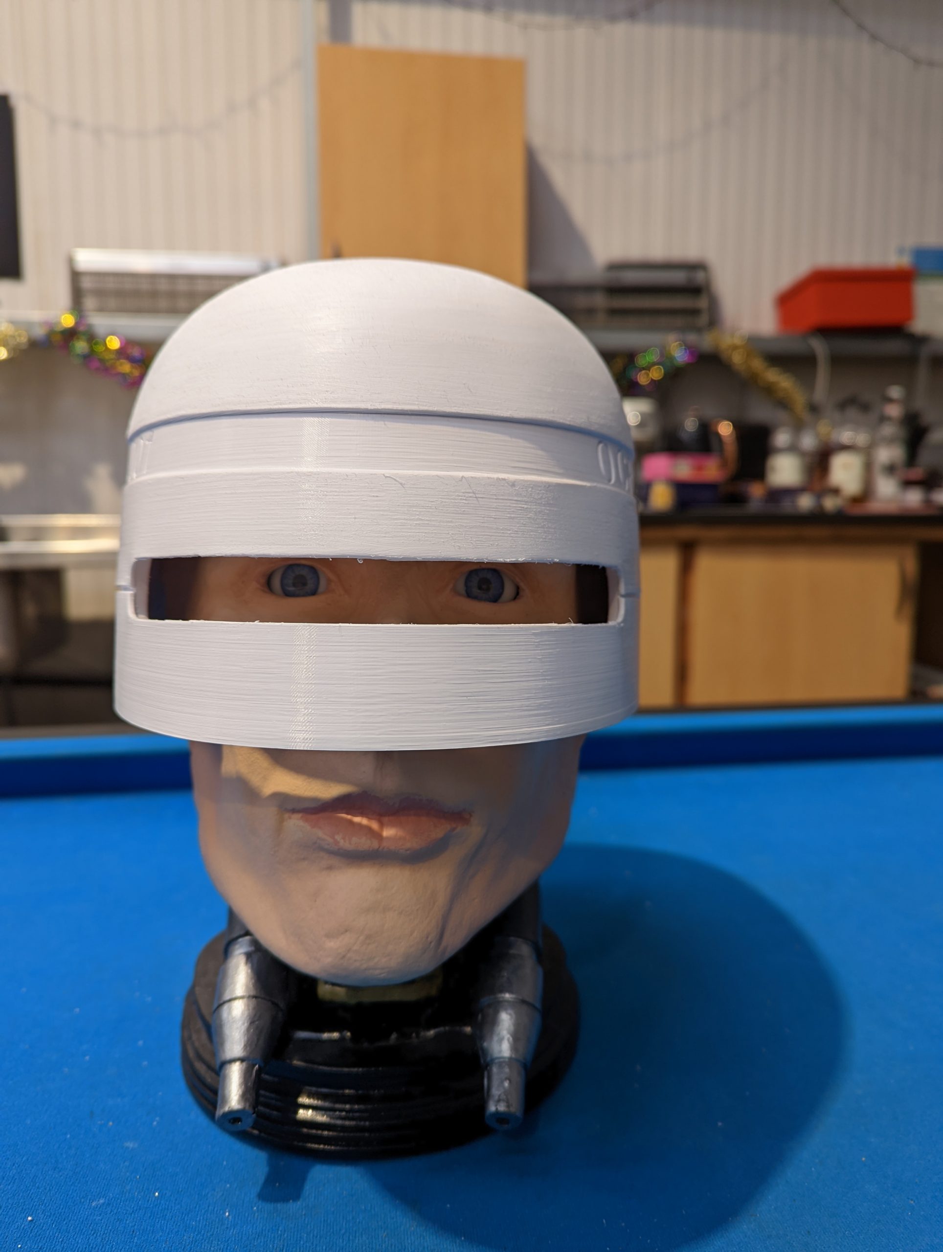 fitting helmet ontop of robocop head