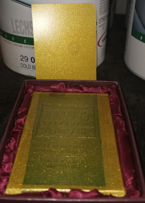 yellowish gold ingot with case